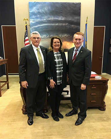 Debi shown with Senator James Lankford